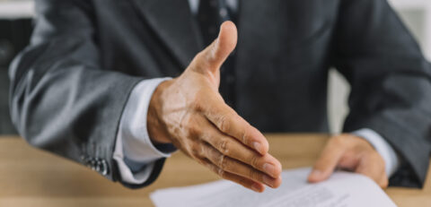 close-up-businessman-outstretched-hand-handshake